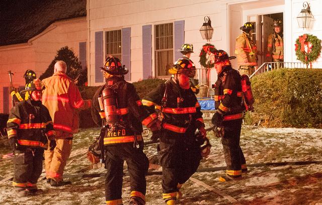 RFD Firefighters fought an early morning chimney fire that extended into the first floor walls of this Clark Ln home.  12/26/13.  Photo by RFD FF Lester Millman
